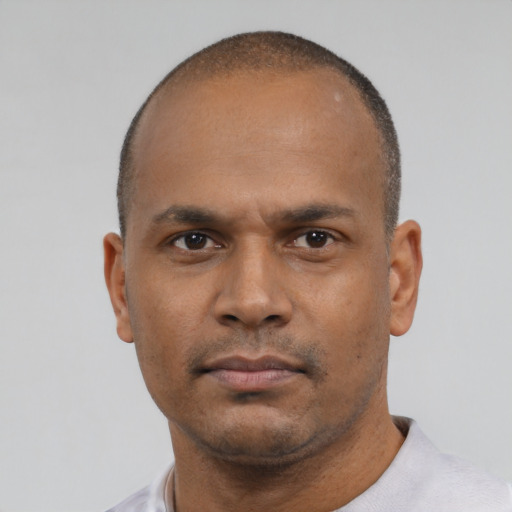 Neutral black young-adult male with short  black hair and brown eyes