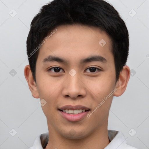 Joyful asian young-adult male with short  brown hair and brown eyes