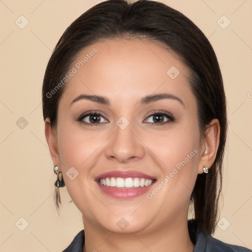 Joyful white young-adult female with long  brown hair and brown eyes