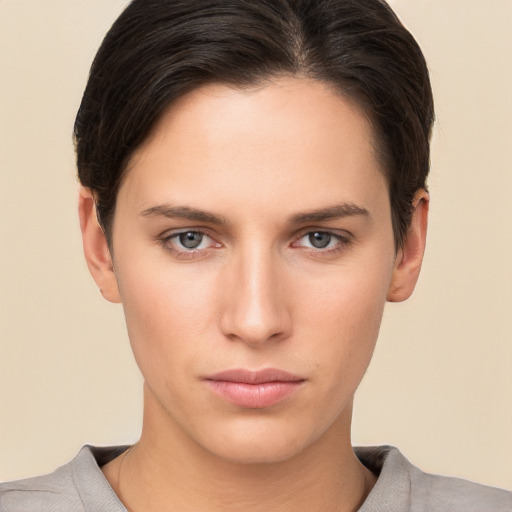 Neutral white young-adult female with short  brown hair and brown eyes