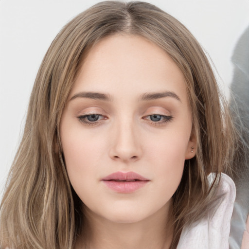 Neutral white young-adult female with long  brown hair and brown eyes