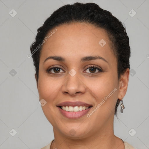 Joyful latino young-adult female with short  brown hair and brown eyes