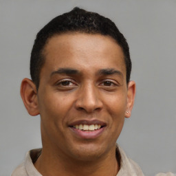 Joyful latino young-adult male with short  brown hair and brown eyes