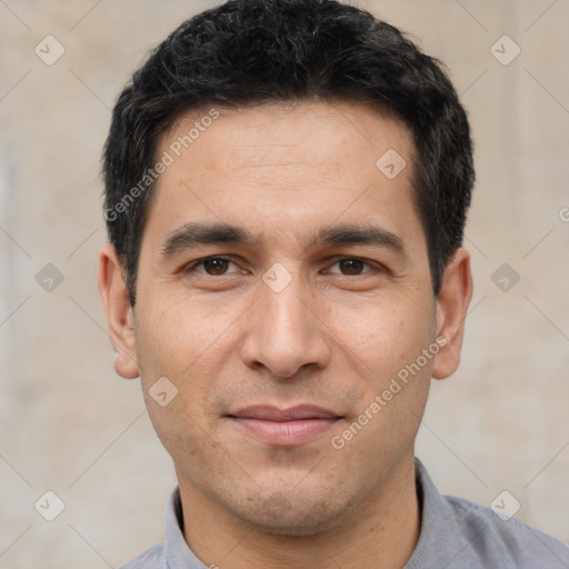 Joyful white young-adult male with short  black hair and brown eyes