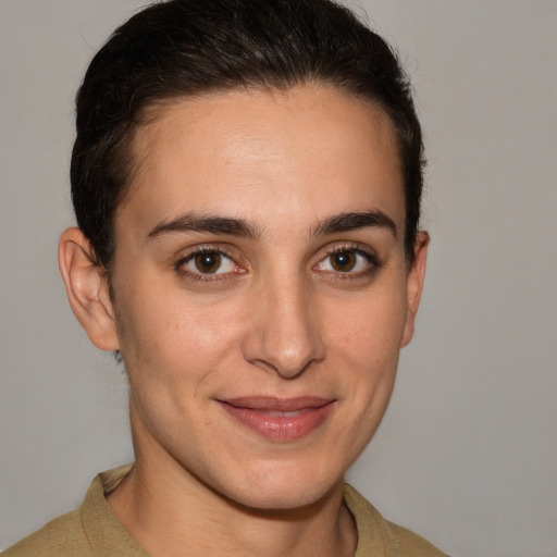 Joyful white young-adult female with short  brown hair and brown eyes