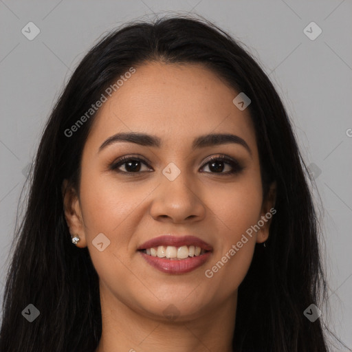 Joyful latino young-adult female with long  brown hair and brown eyes