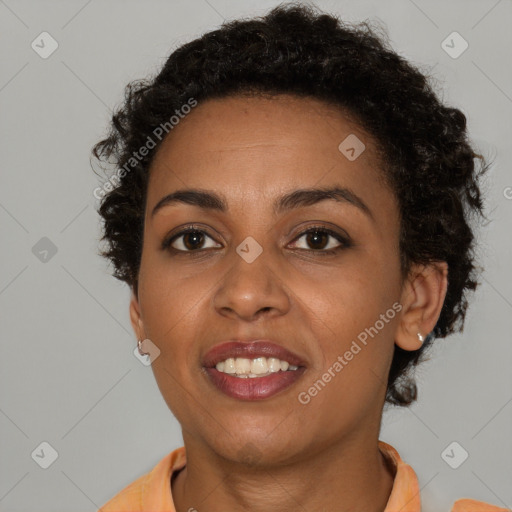 Joyful black young-adult female with short  brown hair and brown eyes