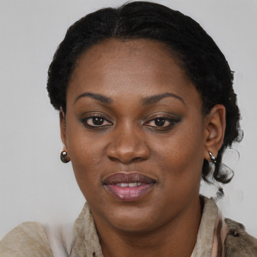 Joyful black young-adult female with short  black hair and brown eyes