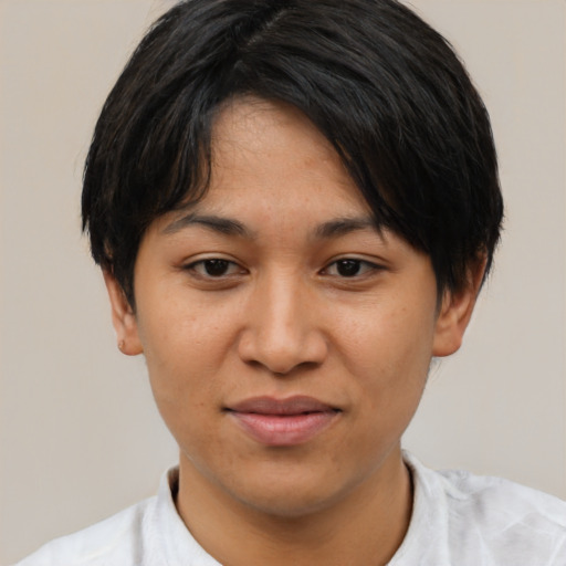 Joyful asian young-adult female with short  black hair and brown eyes