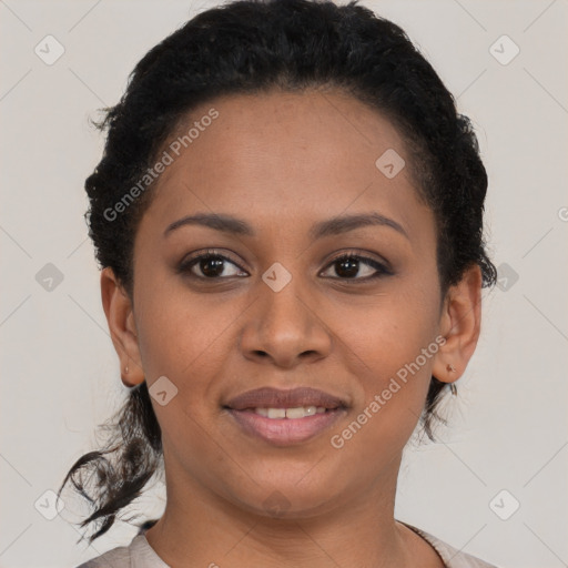 Joyful black young-adult female with short  brown hair and brown eyes