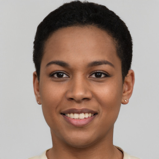 Joyful latino young-adult female with short  black hair and brown eyes