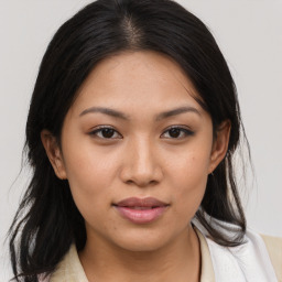 Joyful asian young-adult female with medium  brown hair and brown eyes