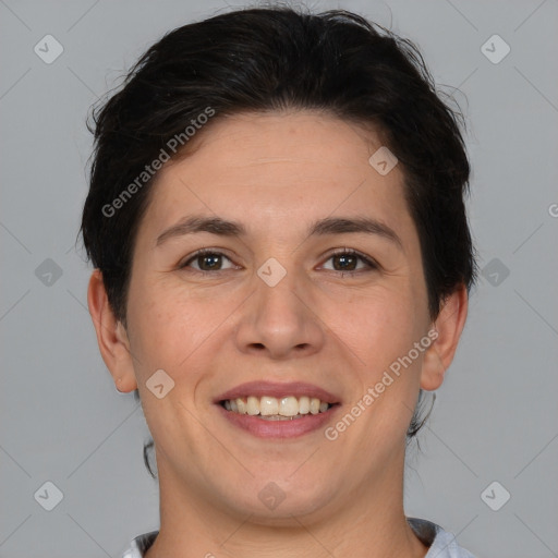 Joyful white adult female with short  brown hair and brown eyes