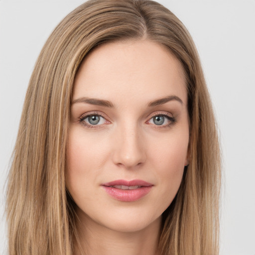 Joyful white young-adult female with long  brown hair and green eyes