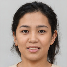 Joyful asian young-adult female with medium  brown hair and brown eyes