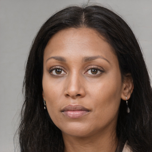 Neutral latino young-adult female with long  brown hair and brown eyes