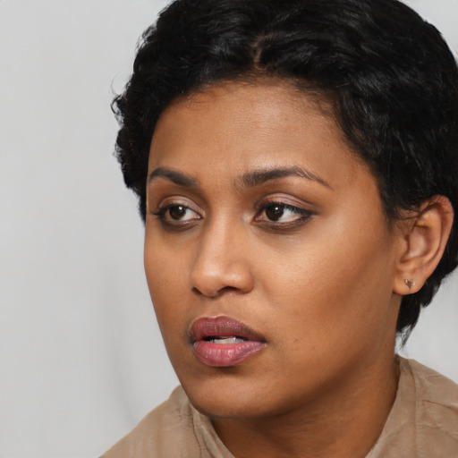 Neutral latino young-adult female with short  black hair and brown eyes