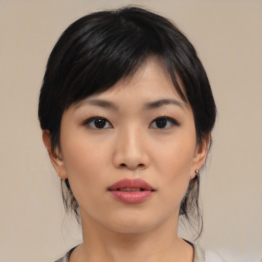Neutral asian young-adult female with medium  black hair and brown eyes