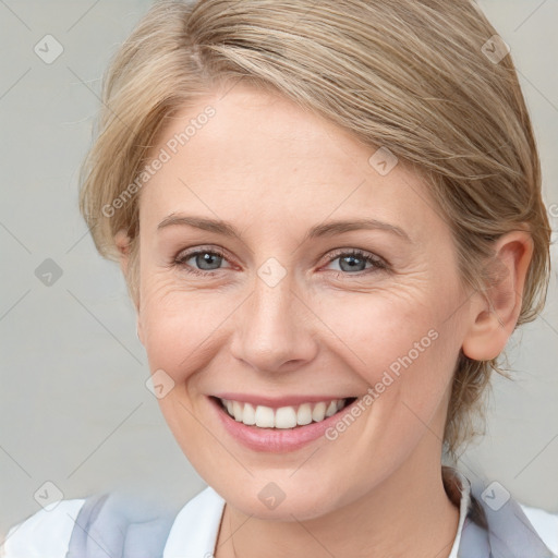 Joyful white young-adult female with medium  brown hair and blue eyes