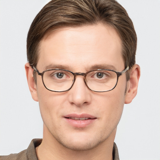 Joyful white adult male with short  brown hair and grey eyes