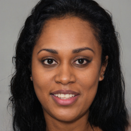 Joyful latino young-adult female with long  brown hair and brown eyes