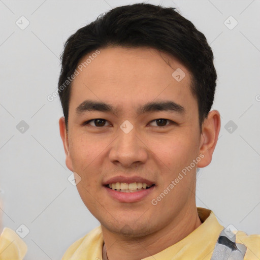 Joyful asian young-adult male with short  black hair and brown eyes