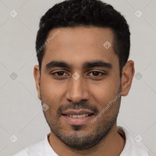 Joyful latino young-adult male with short  black hair and brown eyes