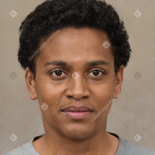 Joyful black young-adult male with short  brown hair and brown eyes