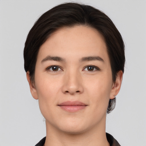 Joyful white young-adult female with short  black hair and brown eyes
