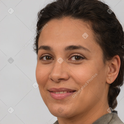 Joyful white adult female with short  brown hair and brown eyes