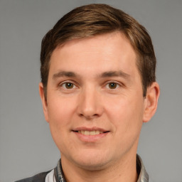 Joyful white young-adult male with short  brown hair and brown eyes