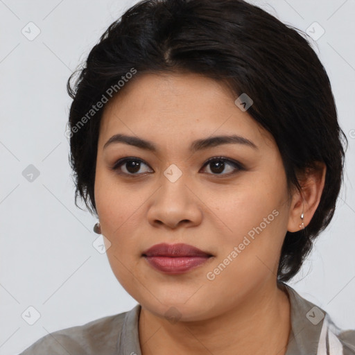 Joyful asian young-adult female with medium  black hair and brown eyes