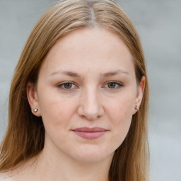 Joyful white young-adult female with long  brown hair and blue eyes