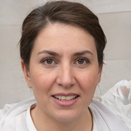 Joyful white adult female with short  brown hair and brown eyes