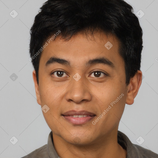 Joyful asian young-adult male with short  black hair and brown eyes