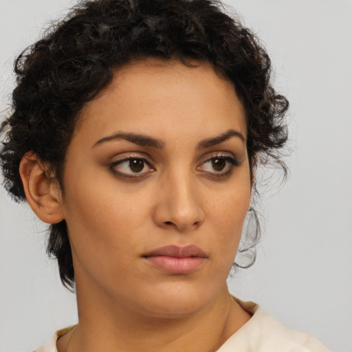 Neutral latino young-adult female with short  brown hair and brown eyes