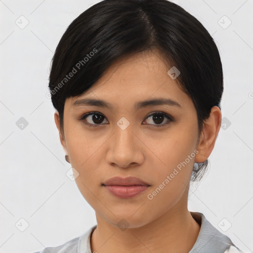 Joyful asian young-adult female with short  black hair and brown eyes