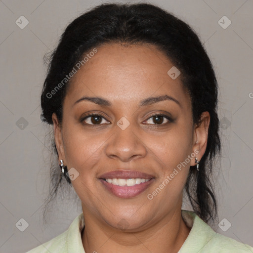 Joyful black adult female with medium  brown hair and brown eyes