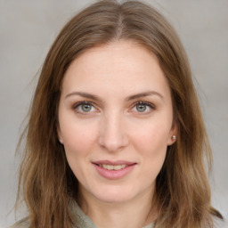 Joyful white young-adult female with medium  brown hair and blue eyes