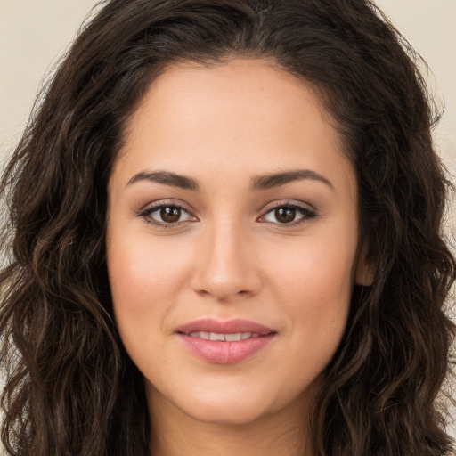 Joyful white young-adult female with long  brown hair and brown eyes