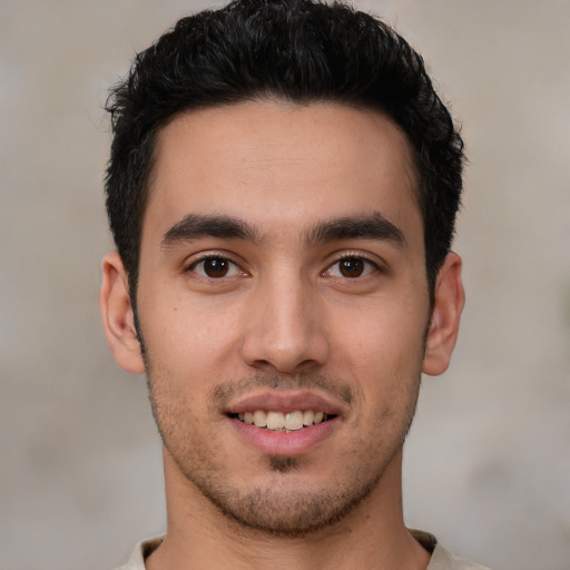 Joyful white young-adult male with short  brown hair and brown eyes