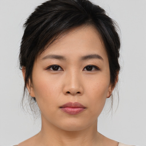 Neutral asian young-adult female with medium  brown hair and brown eyes