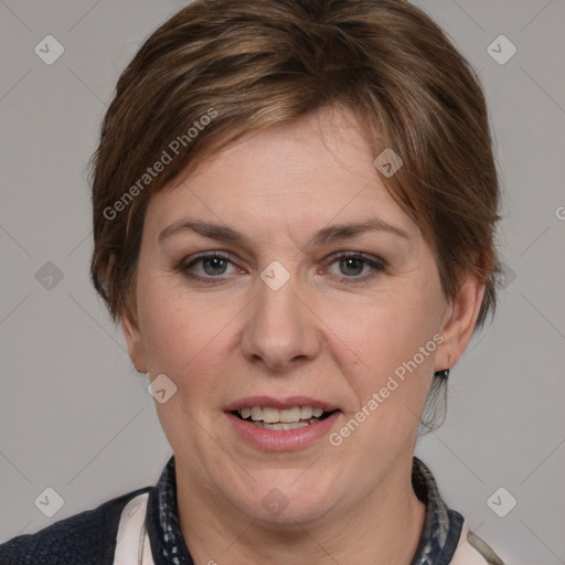 Joyful white adult female with medium  brown hair and grey eyes