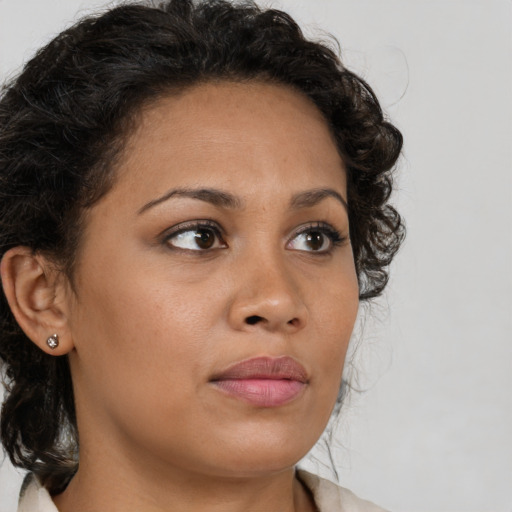 Neutral latino young-adult female with medium  brown hair and brown eyes