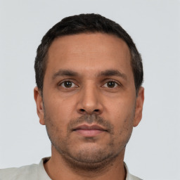 Neutral white young-adult male with short  black hair and brown eyes