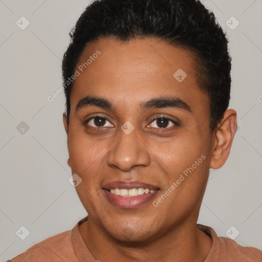 Joyful latino young-adult male with short  black hair and brown eyes