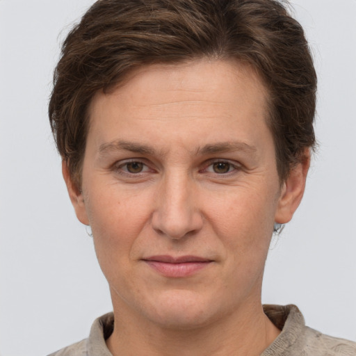 Joyful white adult female with short  brown hair and brown eyes