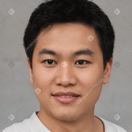 Joyful asian young-adult male with short  black hair and brown eyes