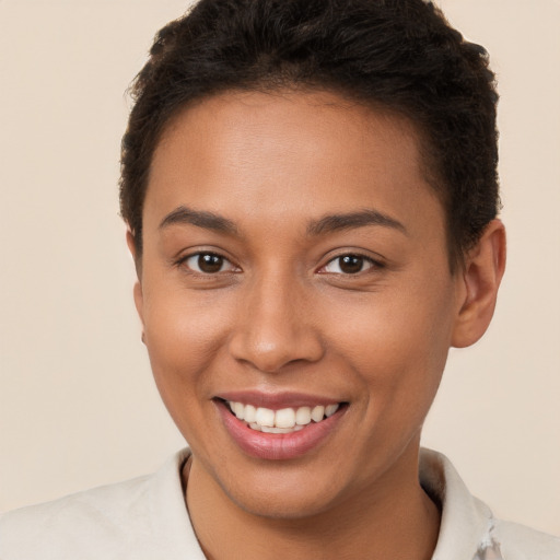 Joyful white young-adult female with short  brown hair and brown eyes