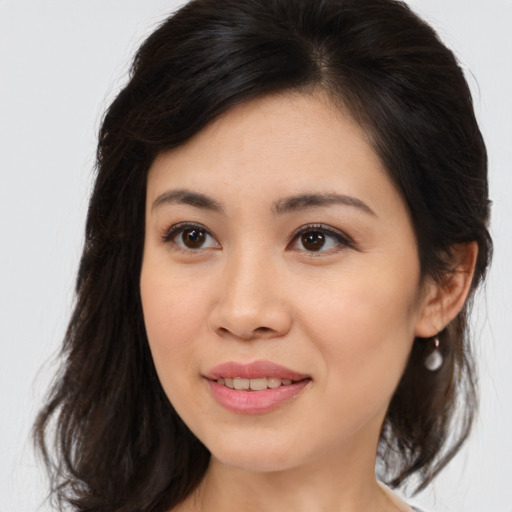 Joyful asian young-adult female with medium  brown hair and brown eyes